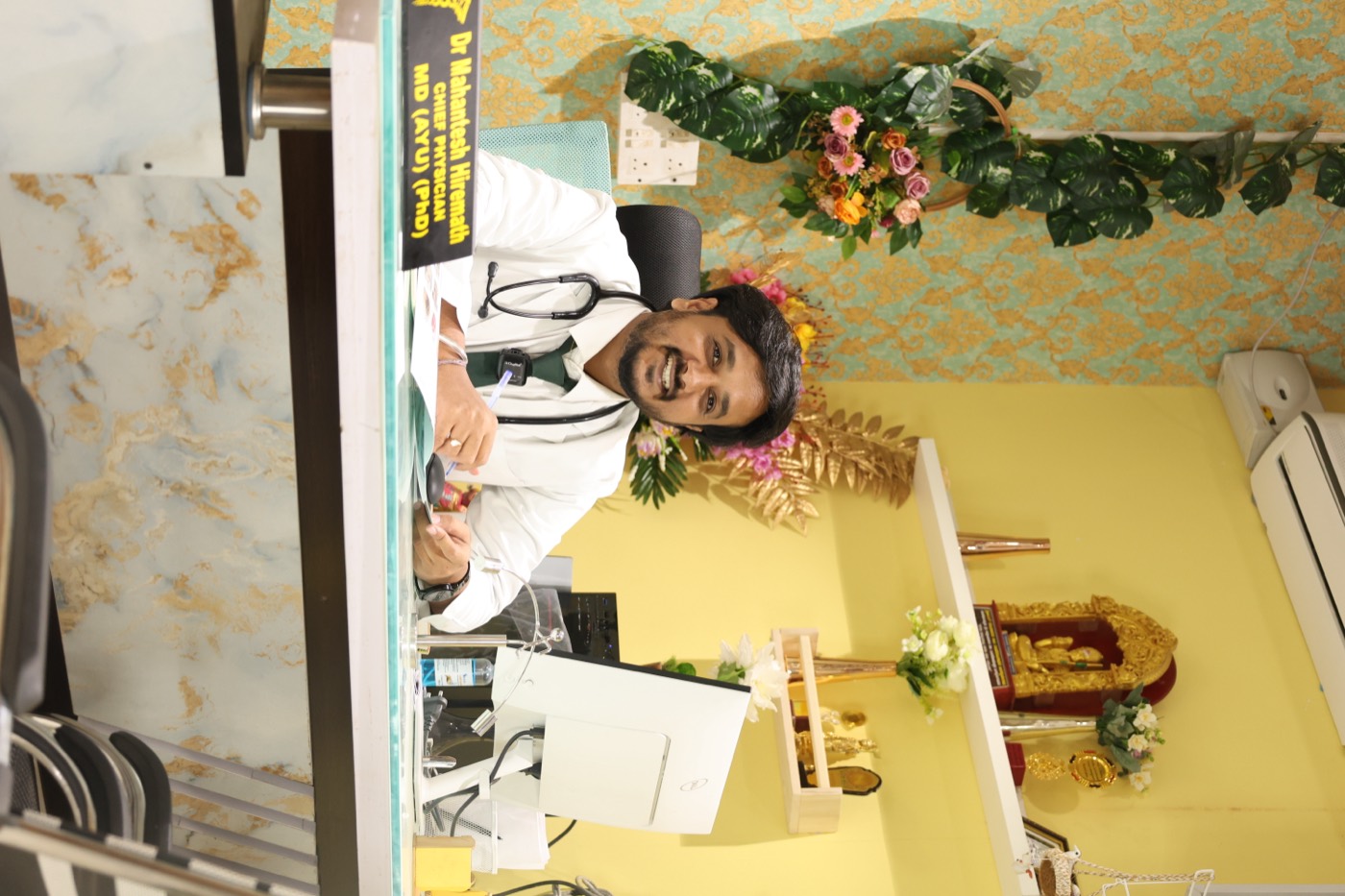 Dr. Mahantesh Hiremath at his consultation desk